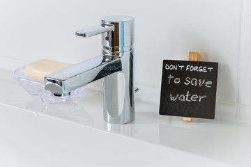 Reminder to save water in the bathroom