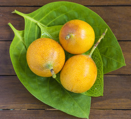 Passion Fruits on Wooden Background