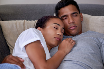 Obraz premium sleeping couch couple portrait