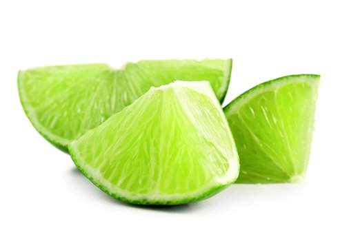 Juicy slices of lime isolated on white