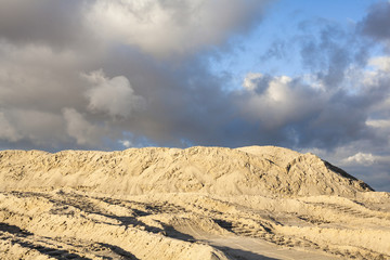 Piles of sand with caterpillar traces