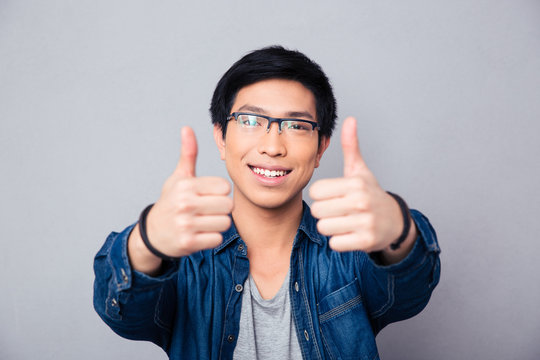 Portrait Of A Happy Asian Man With Thumb Up