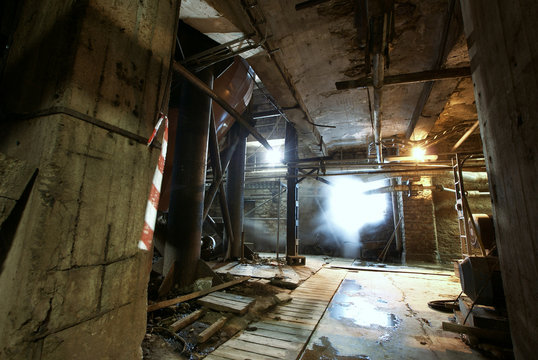 Old creepy, dark, decaying, destructive, dirty factory