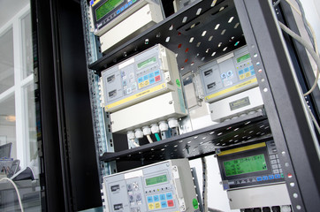 Digital gas meter, mounted in rack - obrazy, fototapety, plakaty