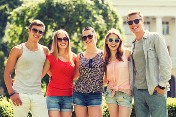 group of smiling friends outdoors