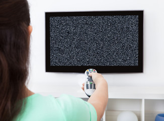 Woman In Front Of Television With No Signal