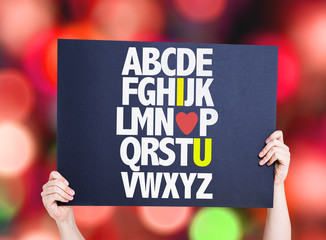 Alphabet with a Romantic message (I Love You) card with bokeh