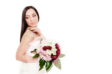 Bride is posing with bouquet over white isolated background