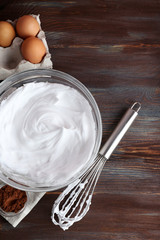 Fototapeta na wymiar Whipped egg whites and other ingredients for cream