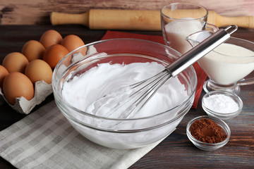 Fototapeta na wymiar Whipped egg whites for cream and other ingredients