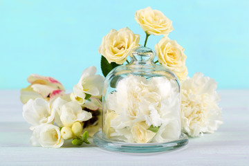 Beautiful composition with flowers on turquoise background