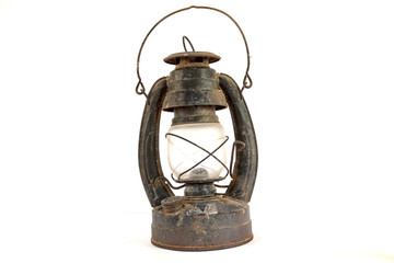 The Paraffin lamp and Old dusty oil lamp on white background