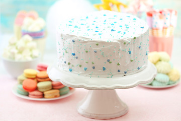 Birthday decorated cake on color background