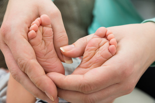 Baby Feet In Mother Hand