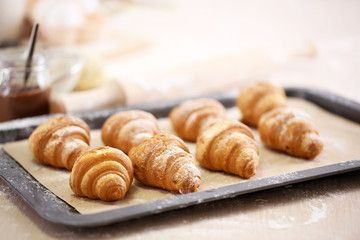 Baking croissant cookies.