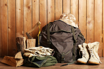 Hunting gear on wooden background