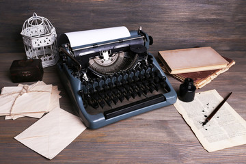 Retro typewriter on wooden background