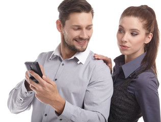 Attractive couple taking a selfie together on white background