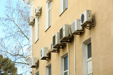 Fototapeta na wymiar Air conditioners on wall of building, outdoors