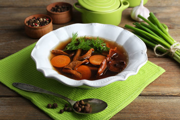 Mushroom soup on wooden background