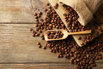 Coffee beans on wooden background