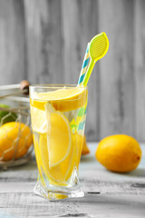 Cocktail with fresh citrus fruits on wooden background