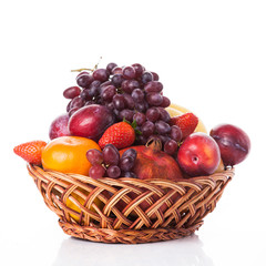 fruit in basket isolated on white background