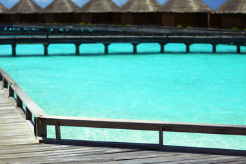 Water villas over ocean background