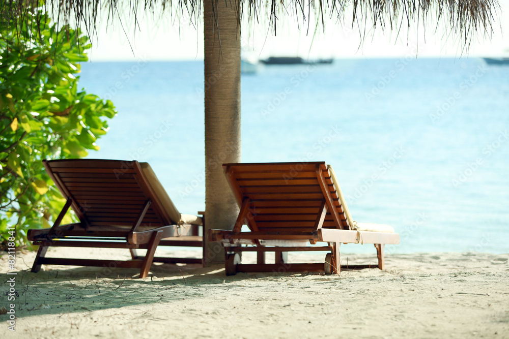 Wall mural sunbeds on beautiful beach in resort