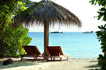 Sunbeds on beautiful beach in resort