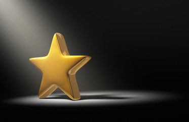 Obraz premium Spotlight On Gold Star On Dark Background