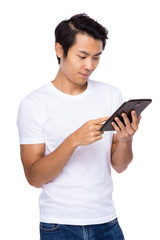 Young man use of digital tablet