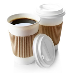 Paper cups of coffee isolated on white