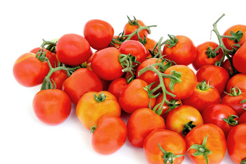 Group of red tomatoes on white background.