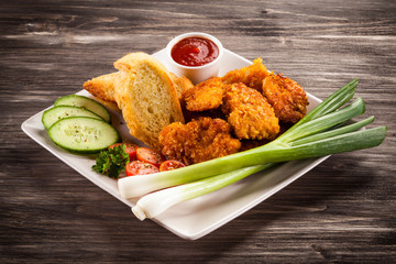Fried chicken nuggets and vegetables
