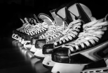 Hockey skates lined up in locker room