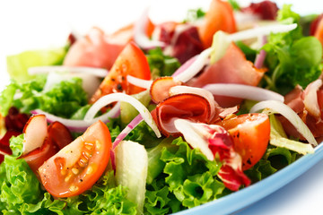 Smoked ham and vegetables on white background