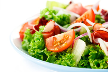 Smoked ham and vegetables on white background