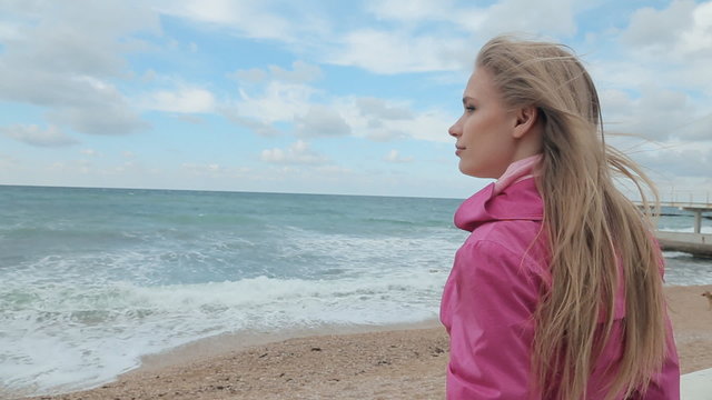 Romantic girl dreaming at sea coast
