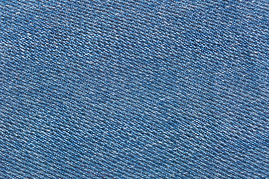 Texture of color jeans textile close up