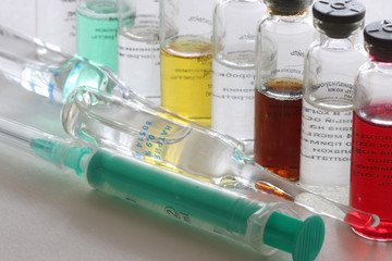 background medicine pill vials syringes