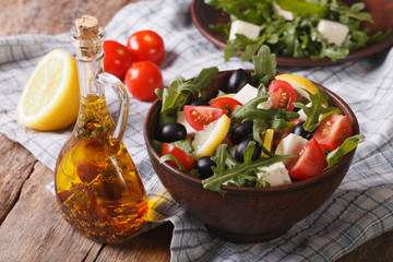 salad with arugula, feta and tomatoes close-up, horizontal