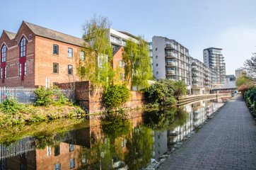 View of canal in Nottingham city centre with old and new buildings