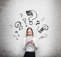 Young business woman is thinking 