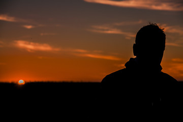 Silhouette of a man  in the sunset