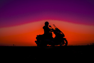 Silhouette motorbike and biker women