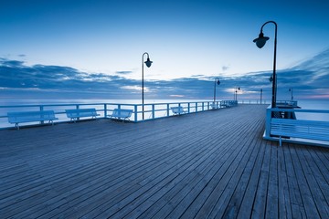 Beautiful morning seascape with wooden pier