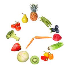 concept fruits and vegetables clock isolated on white background