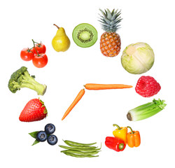 concept fruits and vegetables clock isolated on white background