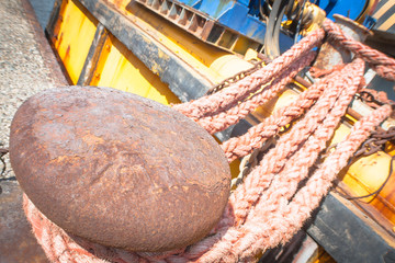 rusty bollard with line